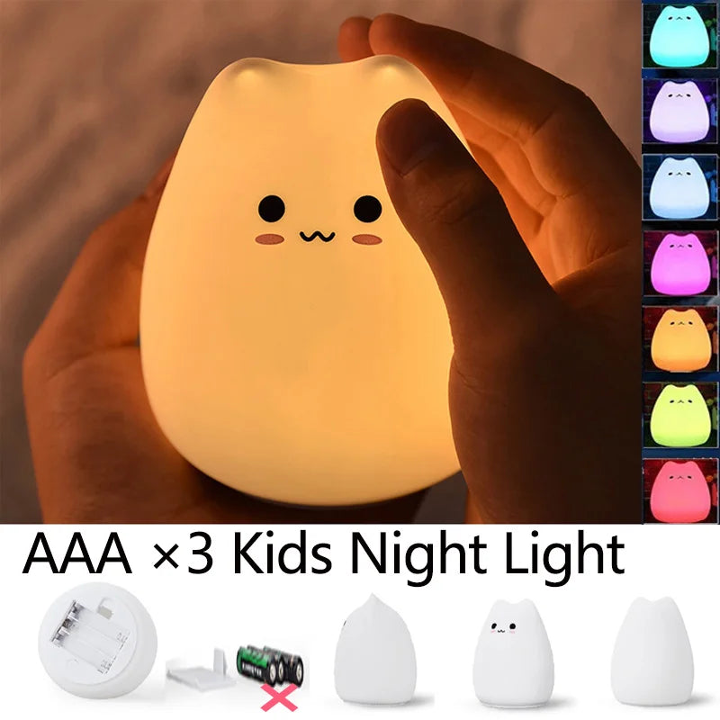 Hands holding a glowing silicone cat night light with seven color options shown at side