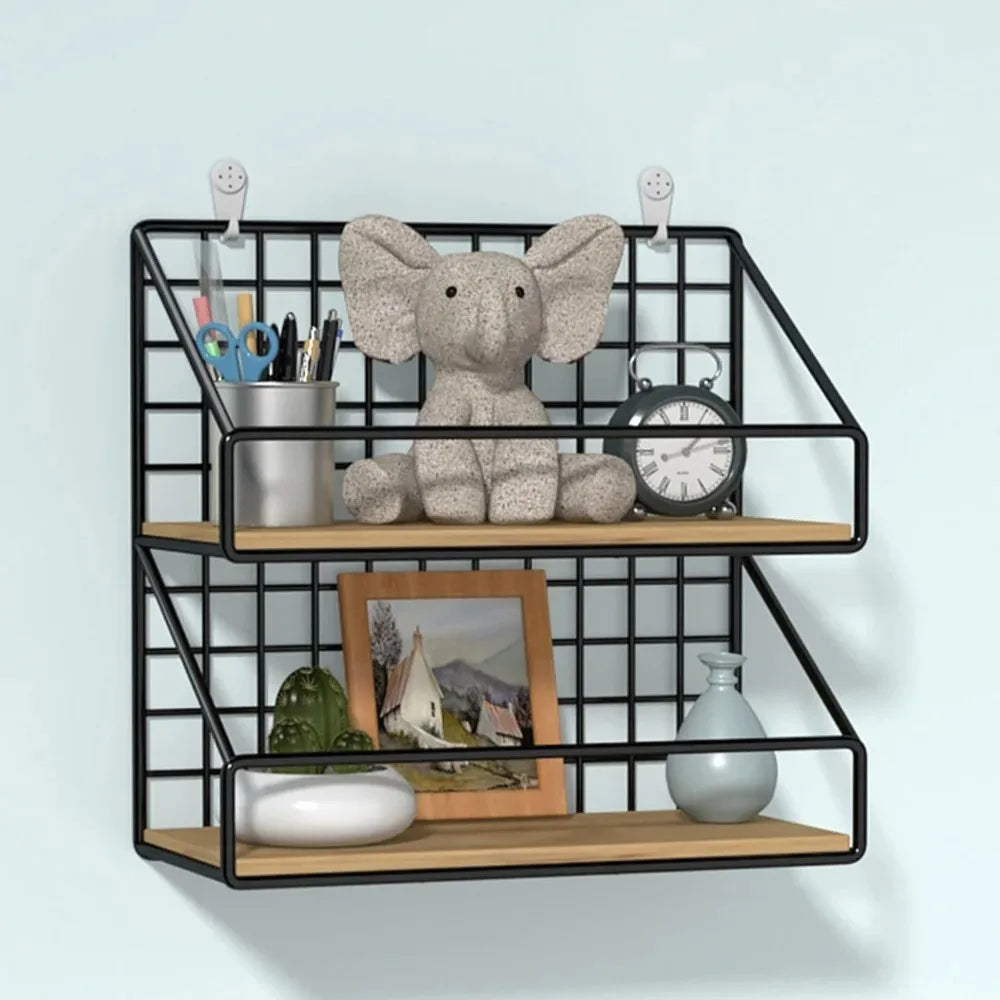Black grid wall shelf displayed on wall with stuffed animal, books, and desk accessories