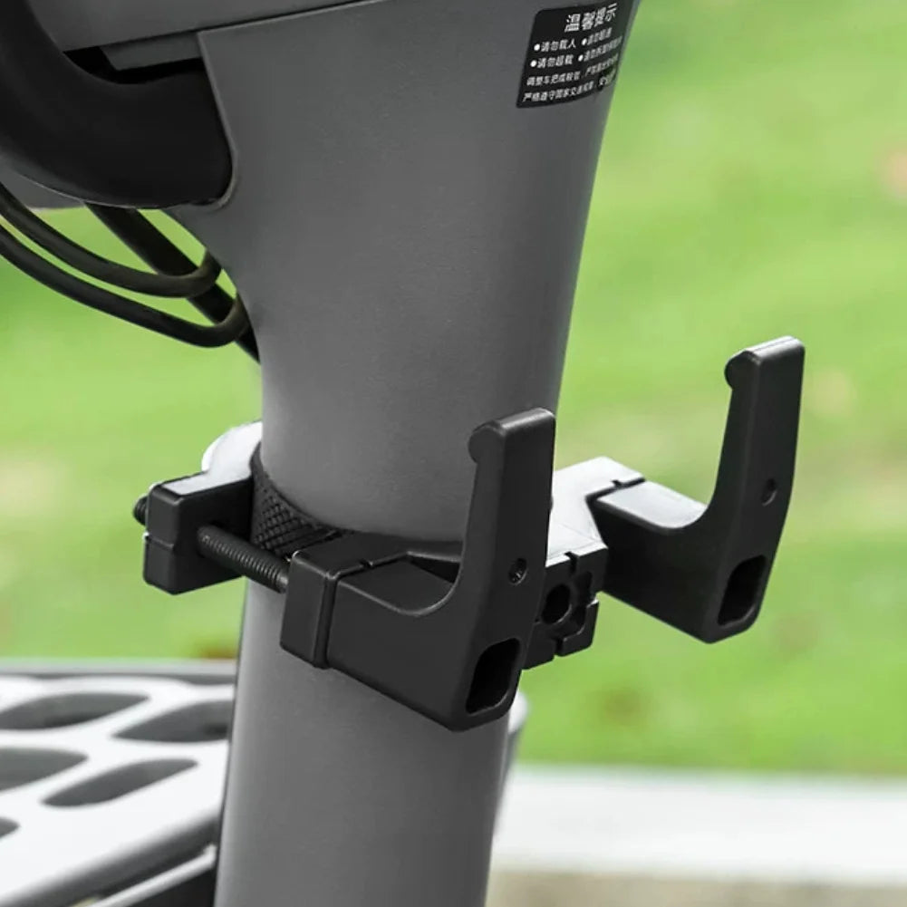 Black ABS clamp-on handlebar hook installed on a scooter handlebar.