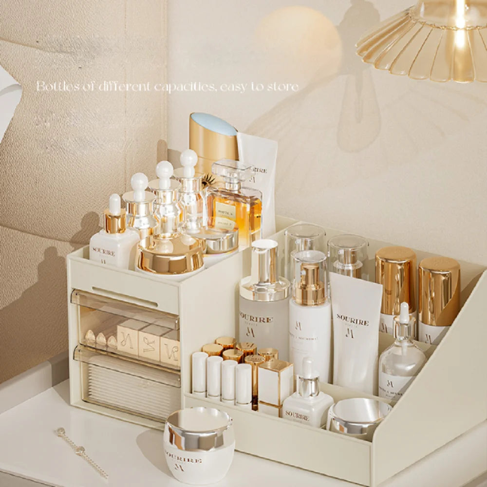 Beige desktop organizer with drawers holding skincare bottles and cosmetics on a vanity
