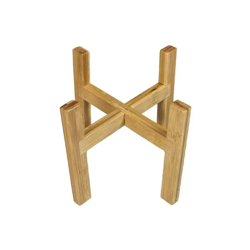 Cross-shaped bamboo plant stand with four legs viewed from above