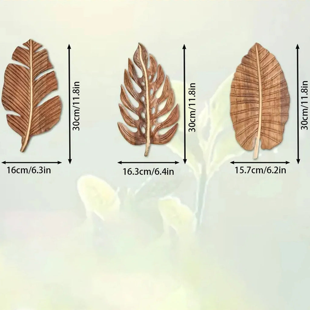 Dimensions of three wooden leaf wall art pieces with size annotations in cm and inches