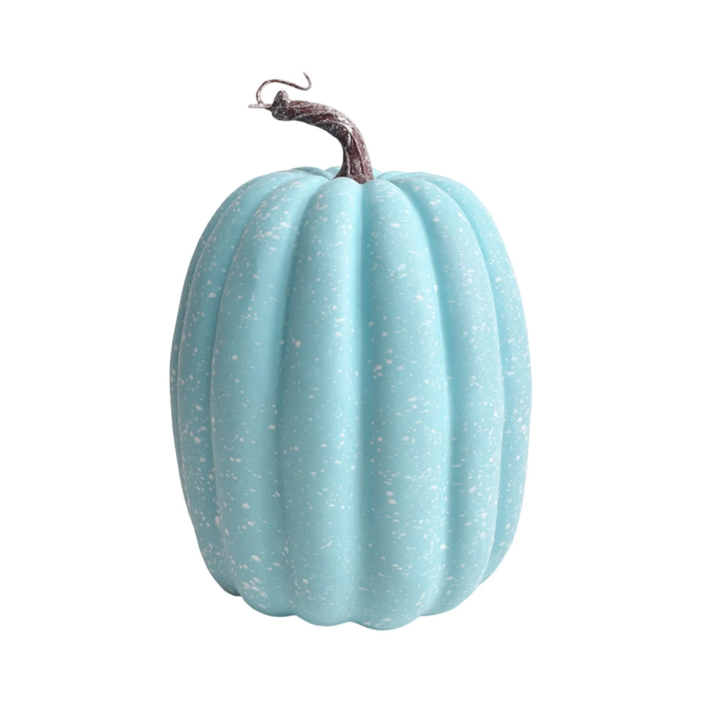 Sky blue artificial pumpkin with white speckles and a brown stem on plain background