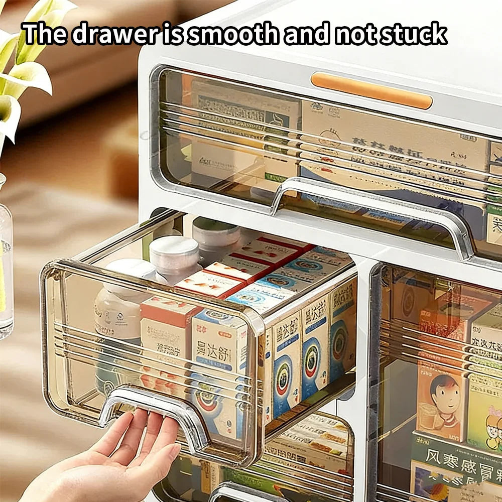 Hand pulling out a drawer from plastic medicine organizer with clear front