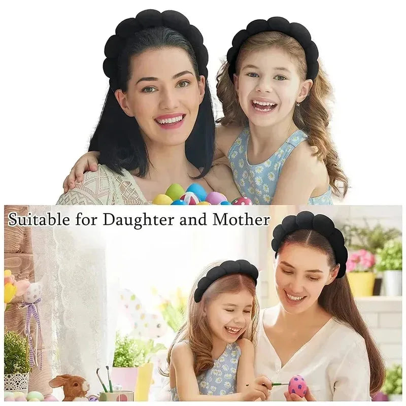Mother and daughter wearing black spa headbands for home or bathroom routines