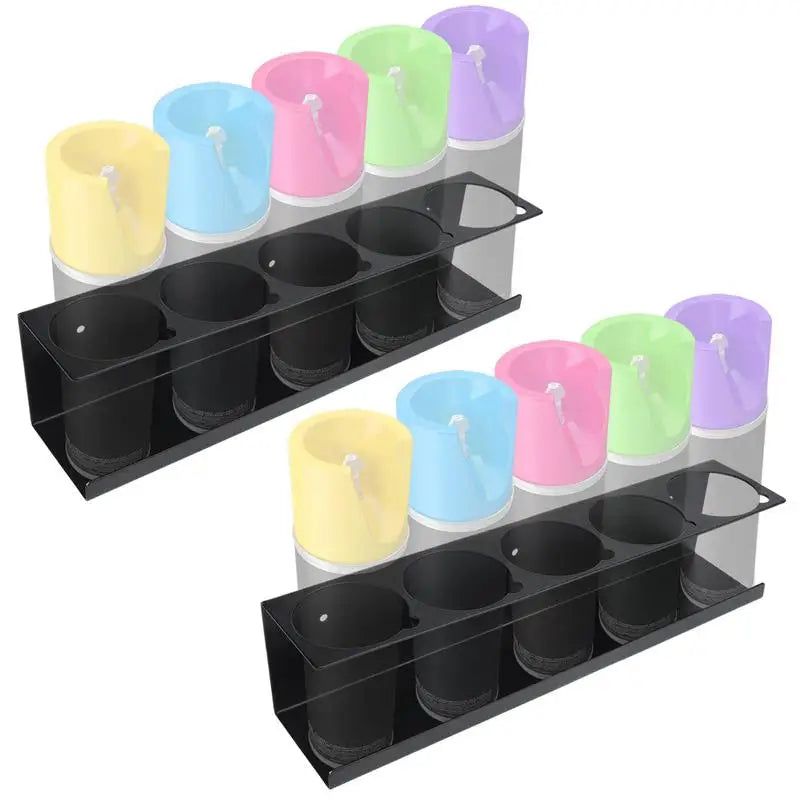 Two black steel racks each holding five pastel aerosol spray cans, product shown from above