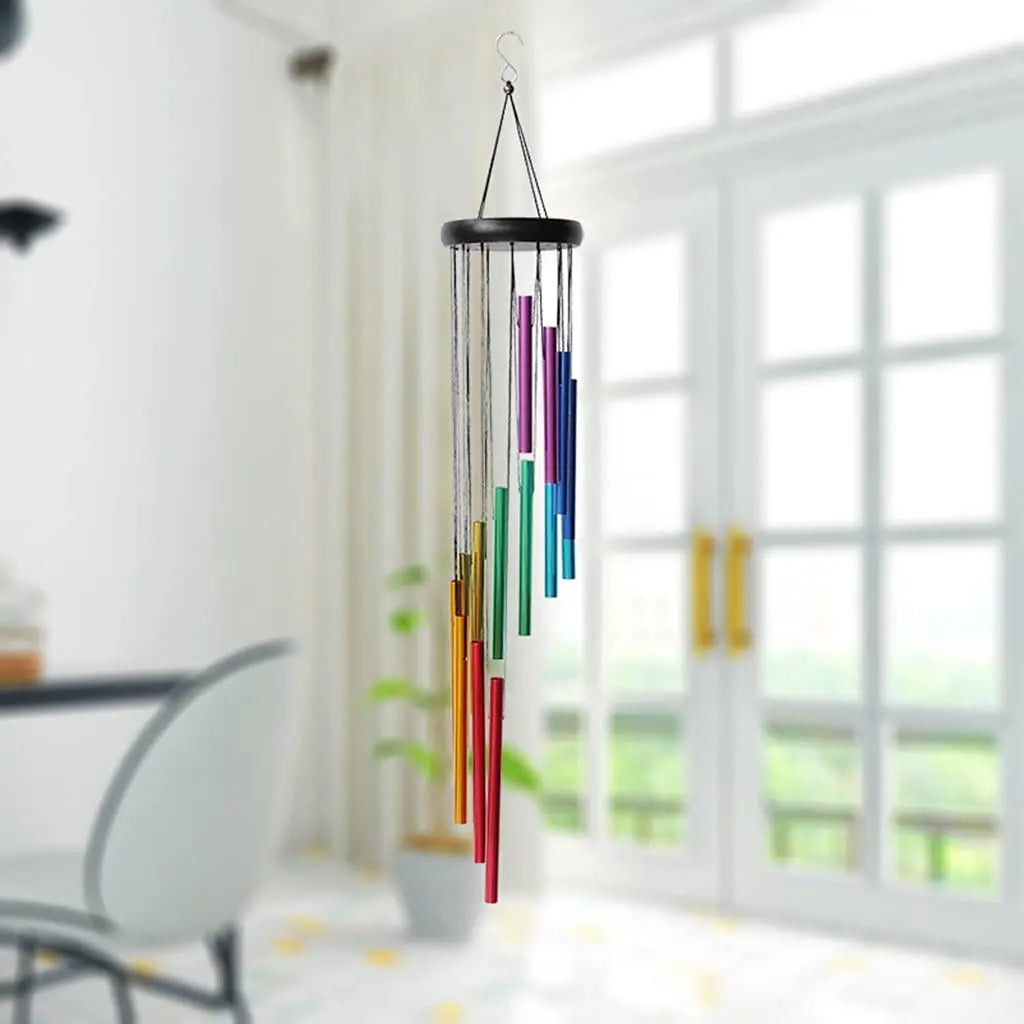 12-tube rainbow wind chime suspended inside near bright windows