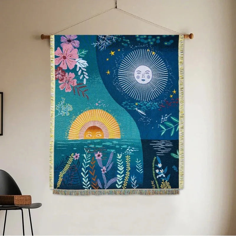 Woven sun and moon tapestry with floral design hanging on wall in living room