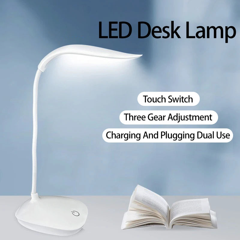 white rechargeable LED desk lamp with touch control and open book on desk