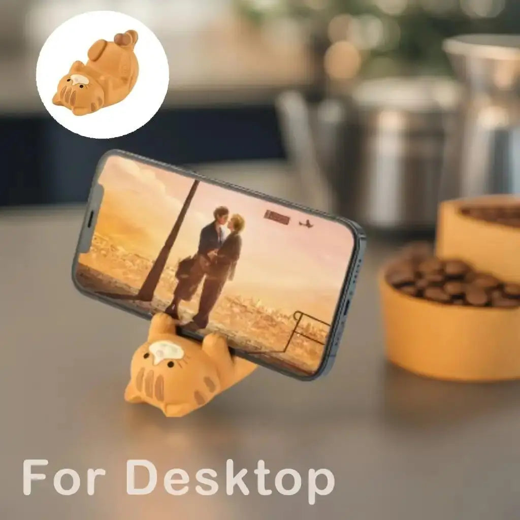 Brown resin cat-shaped phone holder showing material and non-slip bottom details