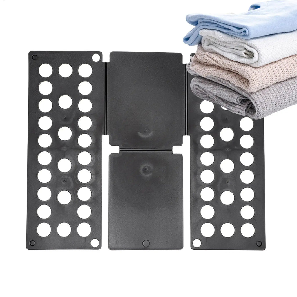 Black folding laundry board open with a stack of folded towels in soft colors
