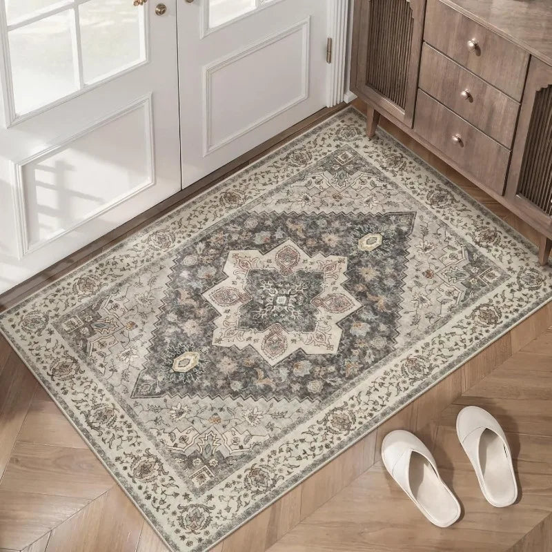 vintage Persian style doormat in neutral floral pattern placed by an entry door