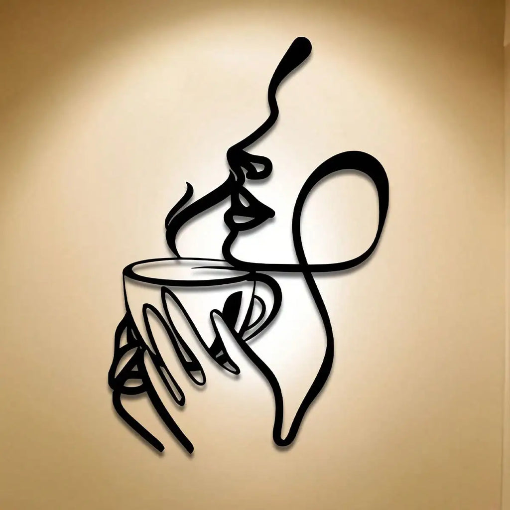 Woman line art metal sculpture wall art on a softly lit tan background