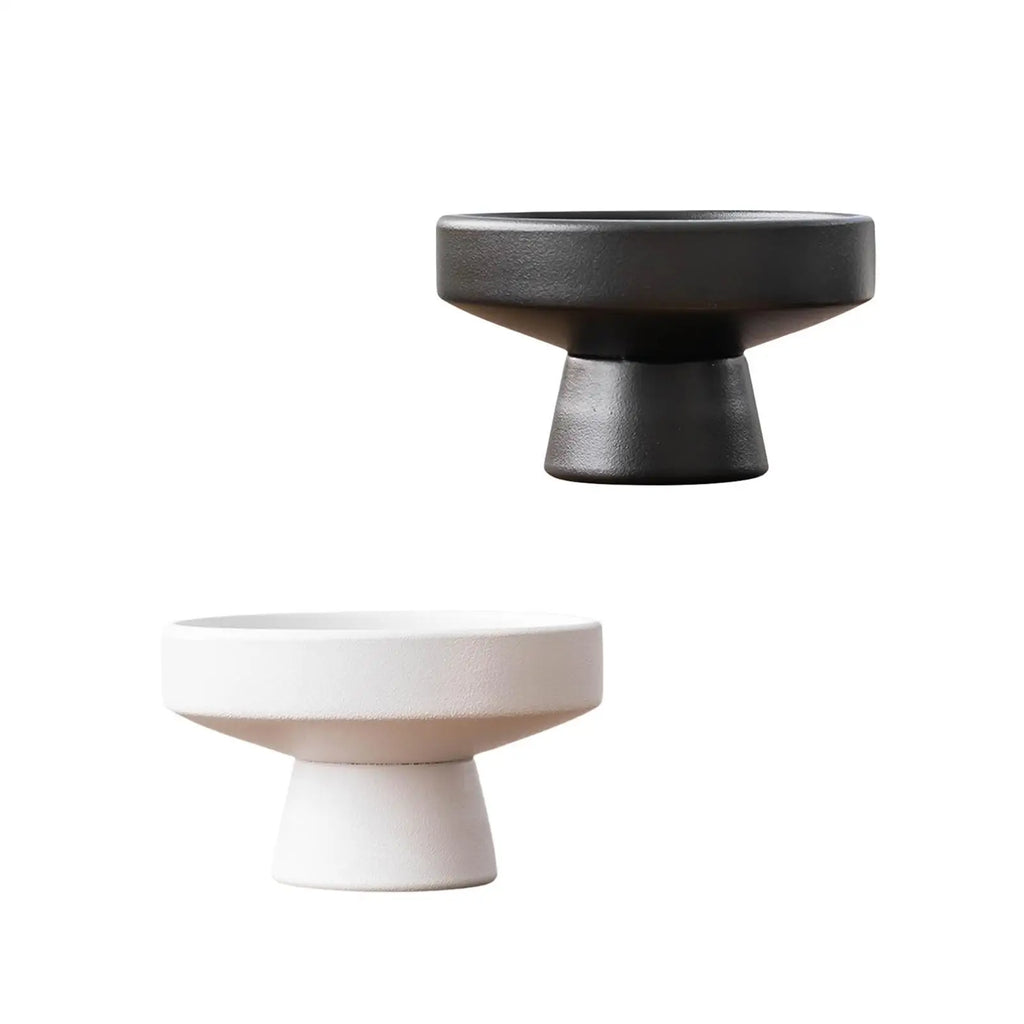 Black and white modern ceramic pedestal flowerpots on white background