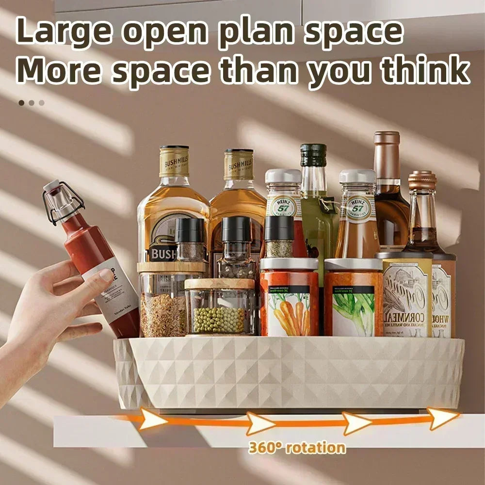 Cream white turntable holding assorted kitchen bottles and jars on a shelf, showing its 360 degree rotation