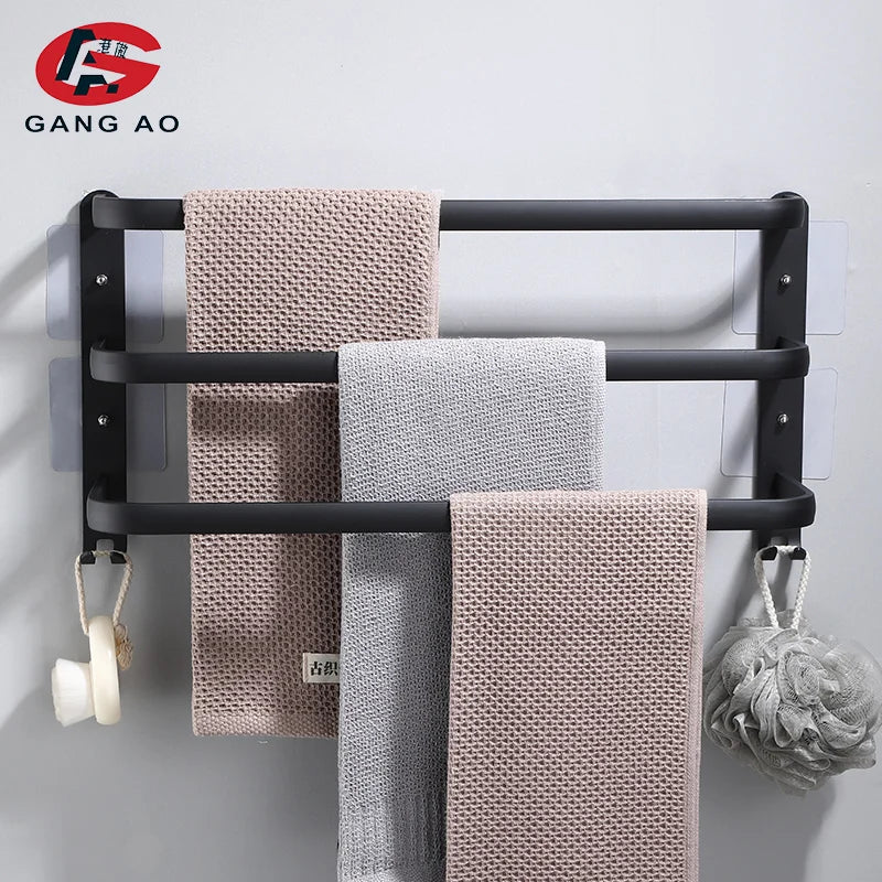 matte black triple towel rack with two hooks and towels in a modern bathroom