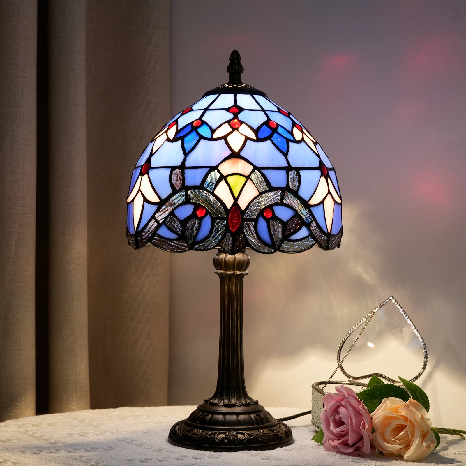 Baroque stained glass lamp illuminated in evening light