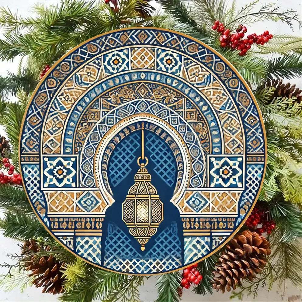round metal Moroccan wall art in blue and gold pattern styled with winter greenery