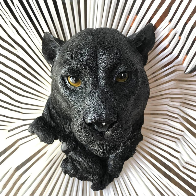 Detailed black panther head resin wall sculpture with yellow eyes viewed from above