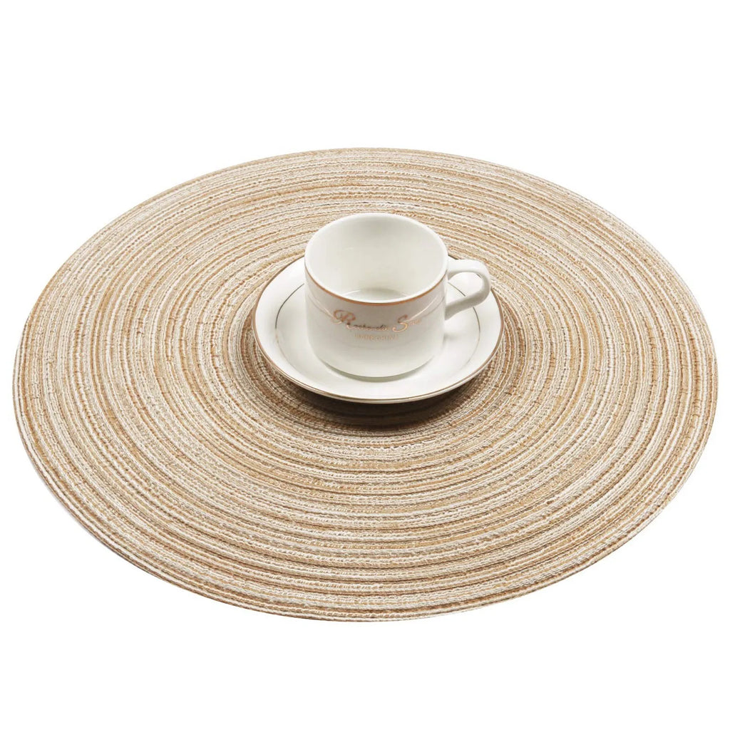 Round braided placemat with white cup and saucer placed on top