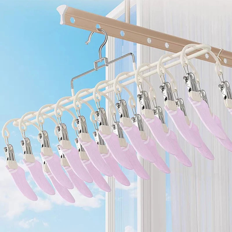 white stainless steel 20-clip hanging drying rack in use with pink socks