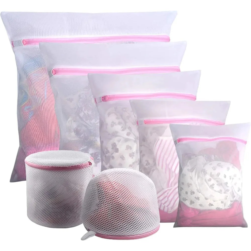 Set of zippered mesh laundry bags in assorted sizes, holding clothing and delicates