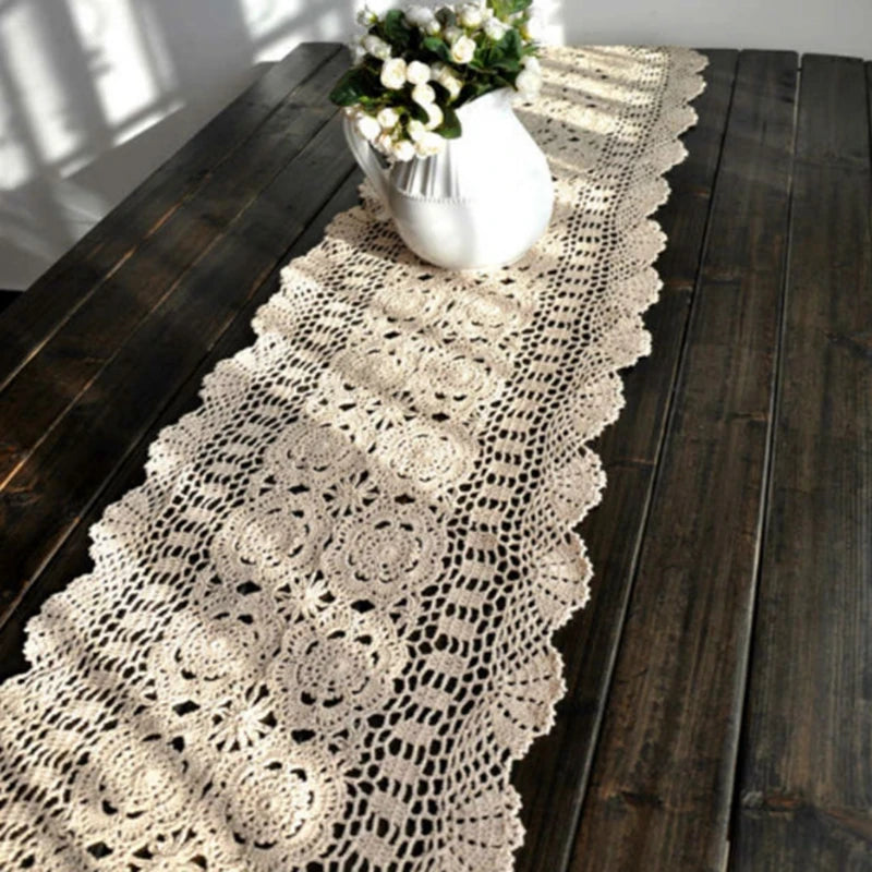 Long crochet table runner styled on a rustic wood table in natural light