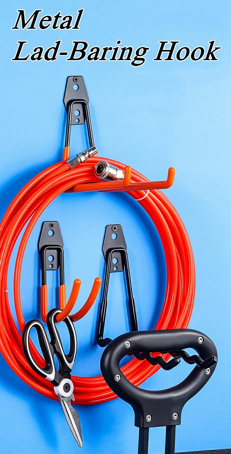 Wall-mounted utility hooks installed on a blue wall, holding coiled hose, scissors, and a handled tool