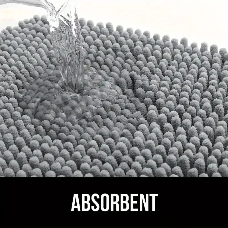 Closeup of water being poured onto absorbent grey microfiber mat