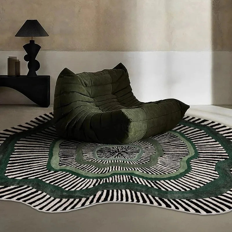 Modern living room with green lounge chair on green-accented stripe rug