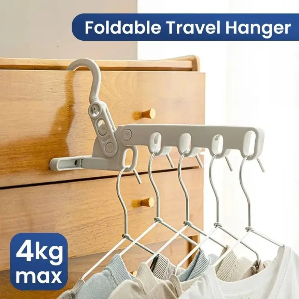 Five-hole foldable drying rack holding several clothes hangers, shown with 4kg max label