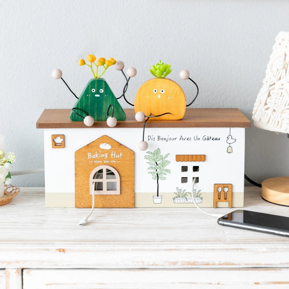 decorative wooden power strip cover with plant figurines on top