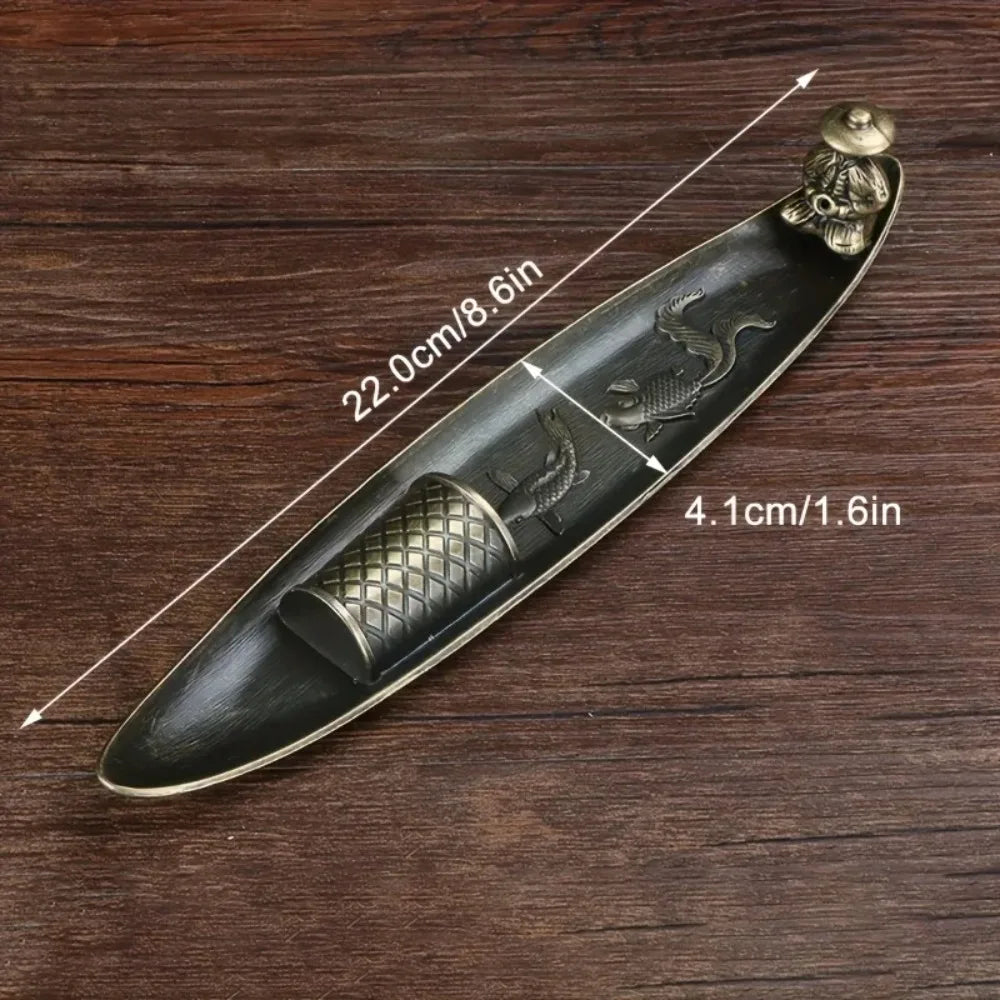 Metal boat incense holder showing dimensions of 22cm by 4.1cm