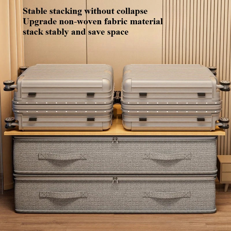 Two stackable gray fabric under-bed storage bins with suitcases on top, shown from the front