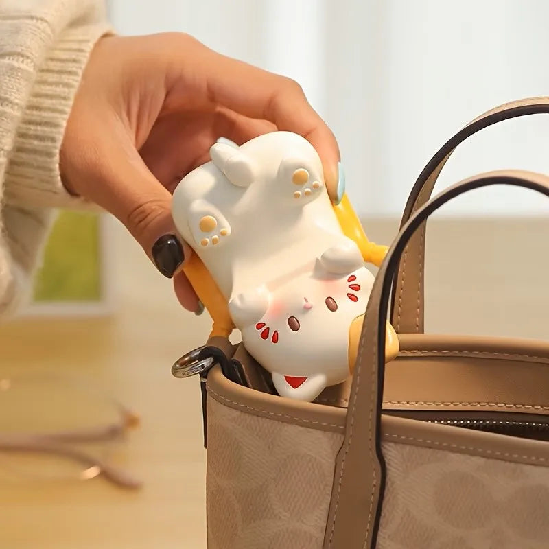 cat eyeglass and phone stand being placed into a handbag for portability