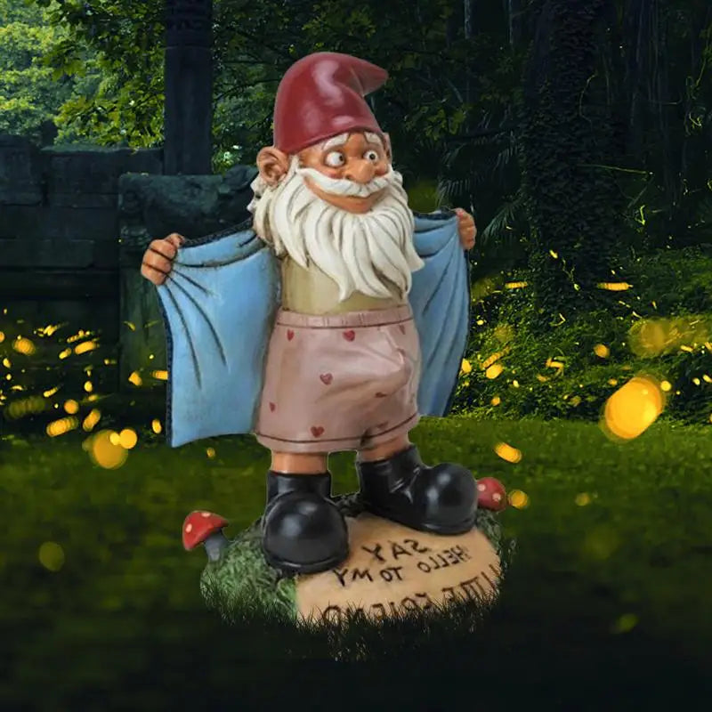 Pink shorts garden gnome statue set in a whimsical garden scene with glowing lights