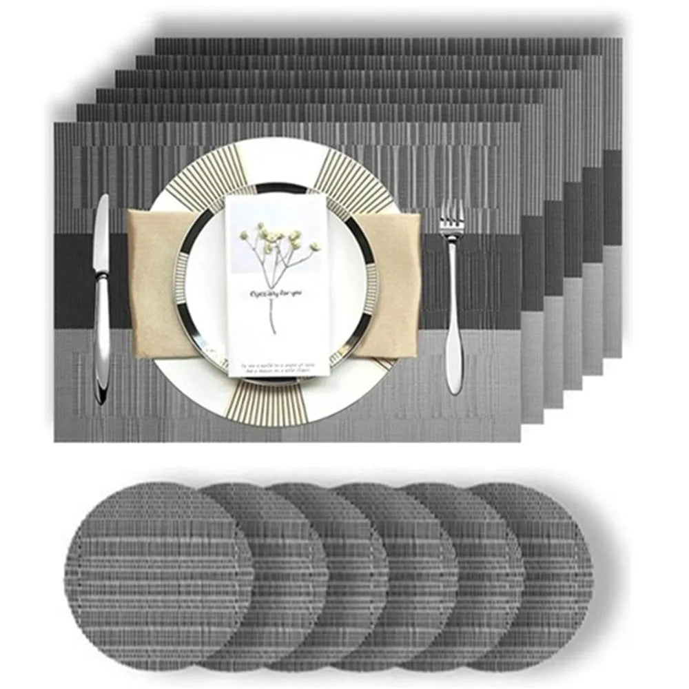 Set of six rectangular woven vinyl placemats and round coasters in a modern neutral pattern.