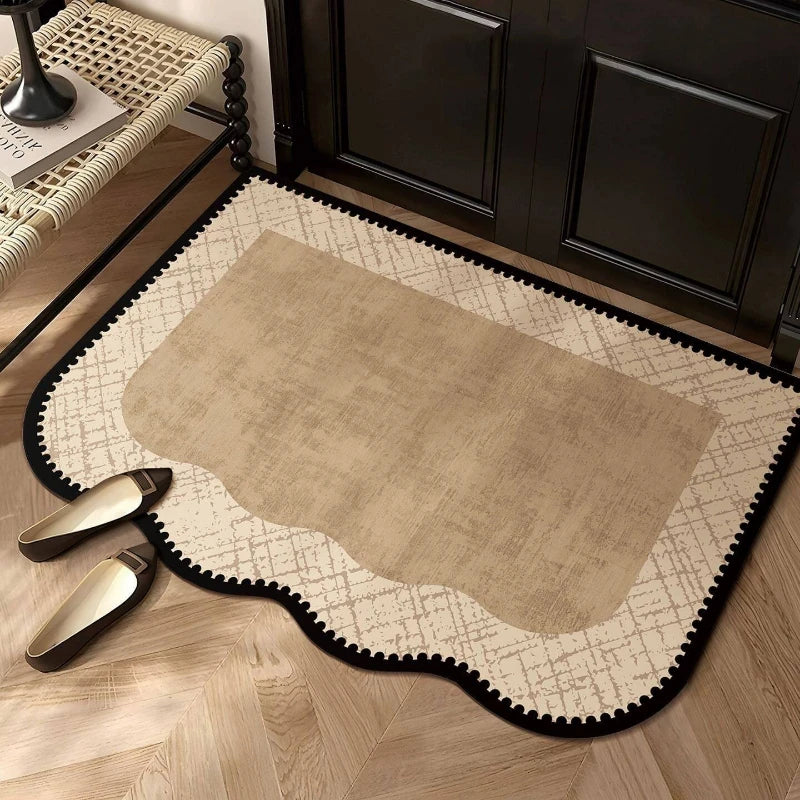 Beige minimalist entryway rug with geometric border in front of black door