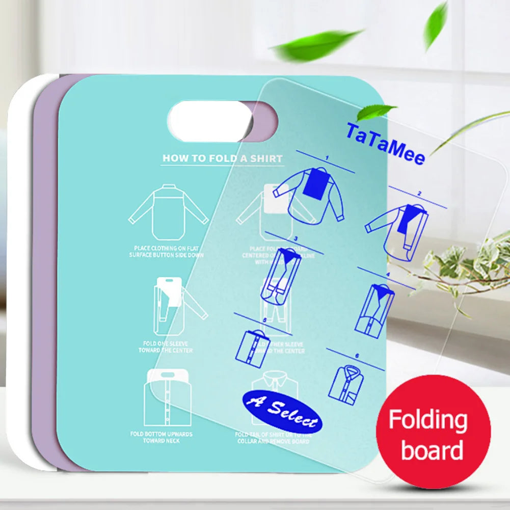 Stack of folding boards in purple, green, and white, showing shirt folding instructions printed on the board