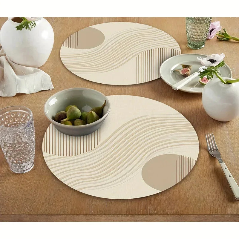 Pair of round beige geometric placemats on a wooden kitchen table