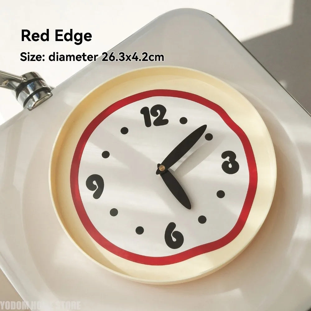 Modern round wall clock with playful wavy red edge on cream background, size shown