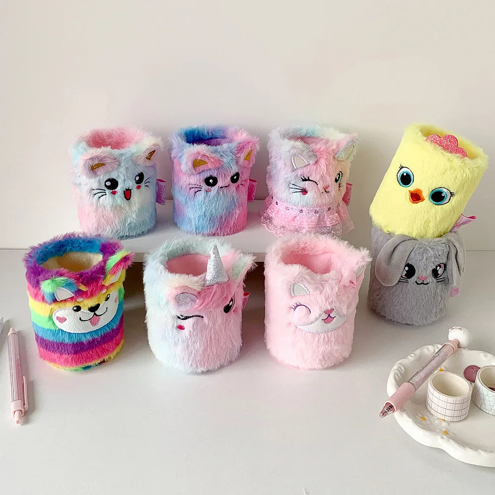 Collection of pastel plush animal pen holders in various animal faces, grouped on a white table