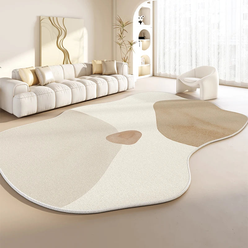 Abstract geometric area rug with soft curves in light and tan hues in living room