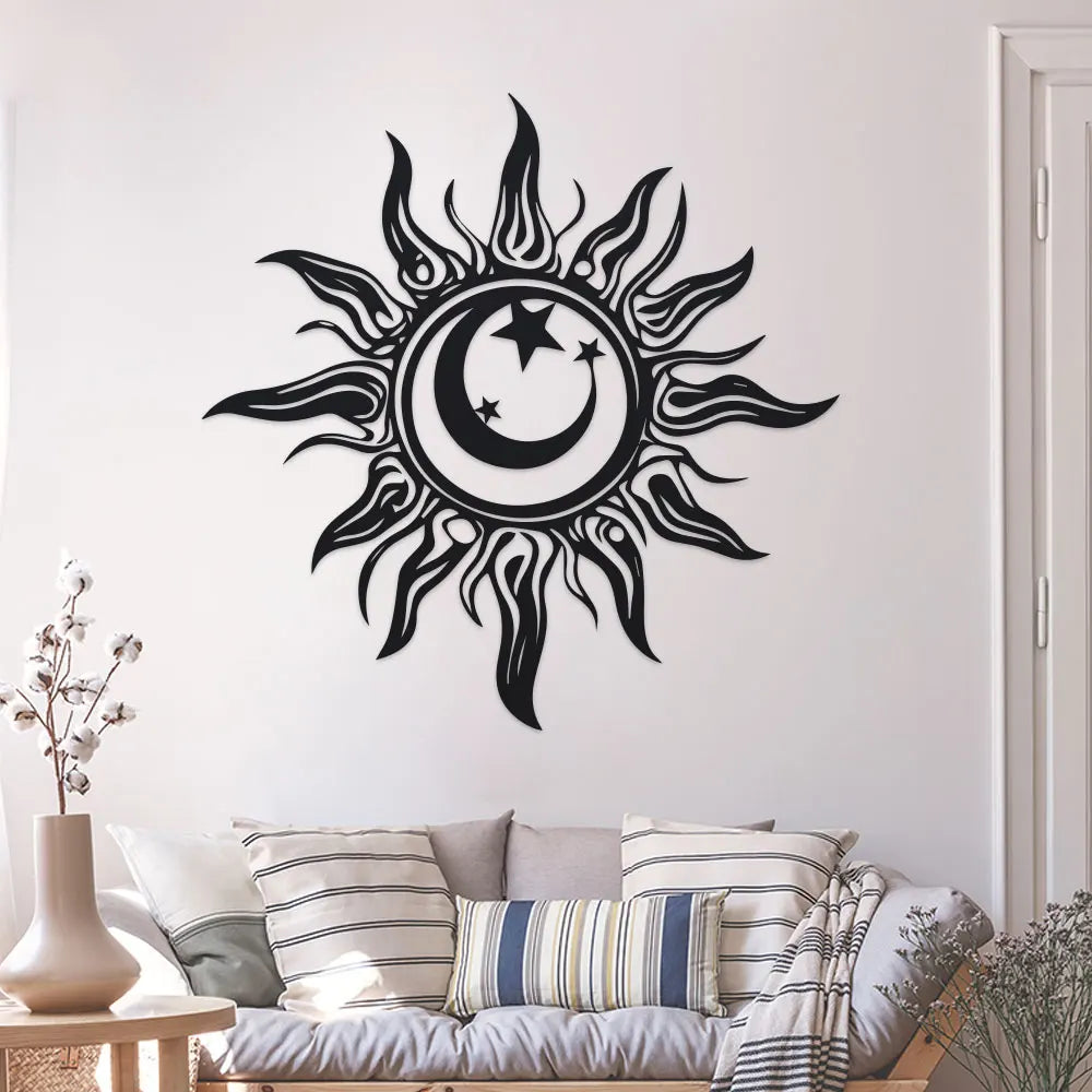 Metal sun and moon wall sculpture mounted above a sofa in a bright living room
