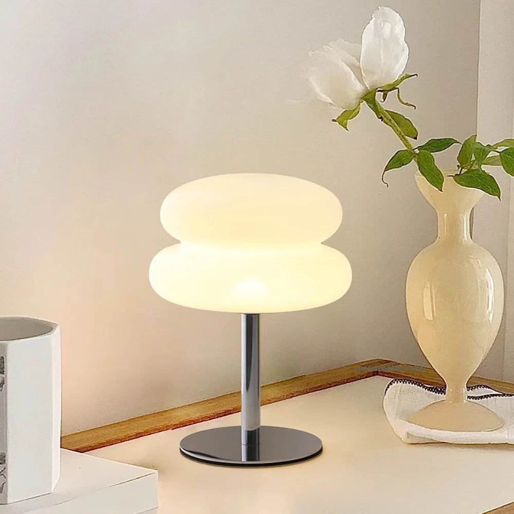 Mushroom LED lamp on a bedroom dresser next to a vase and mug