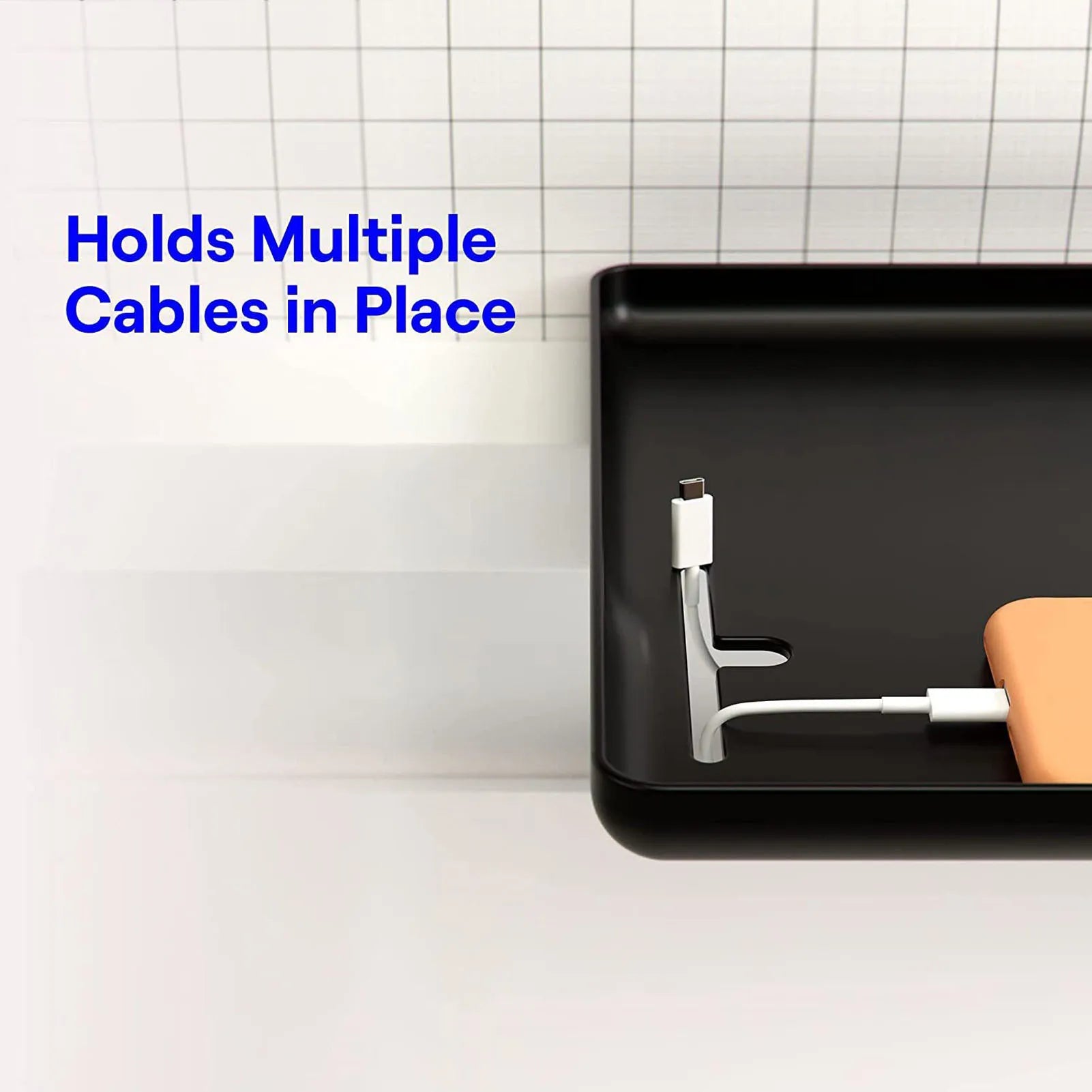 Close-up of bedside shelf T-shaped cable slots in use managing two device cords