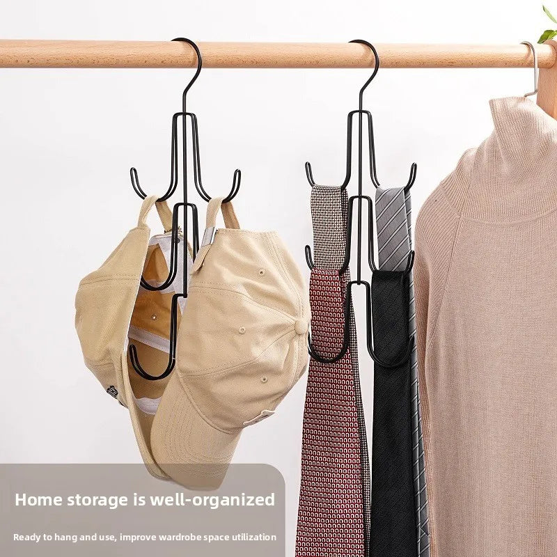 Two multi-hook metal hangers organizing hats and ties on a closet rod beside a sweater