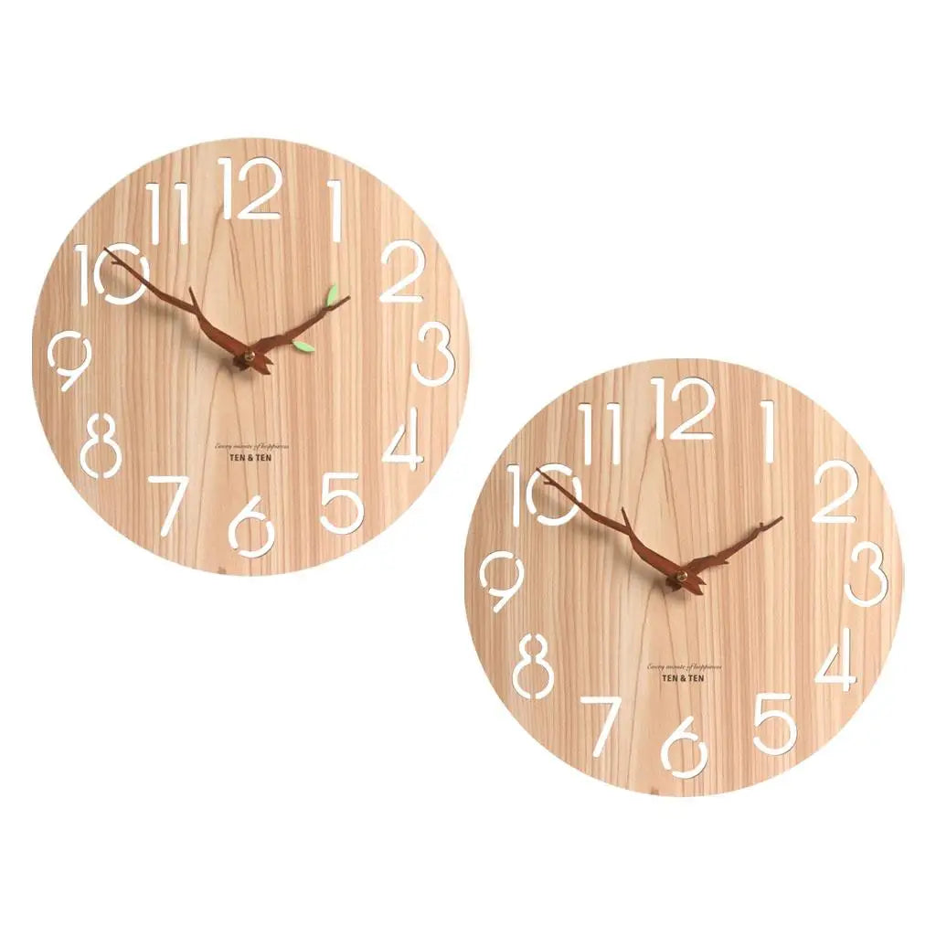 Two round wooden wall clocks with and without leaf accents on hands