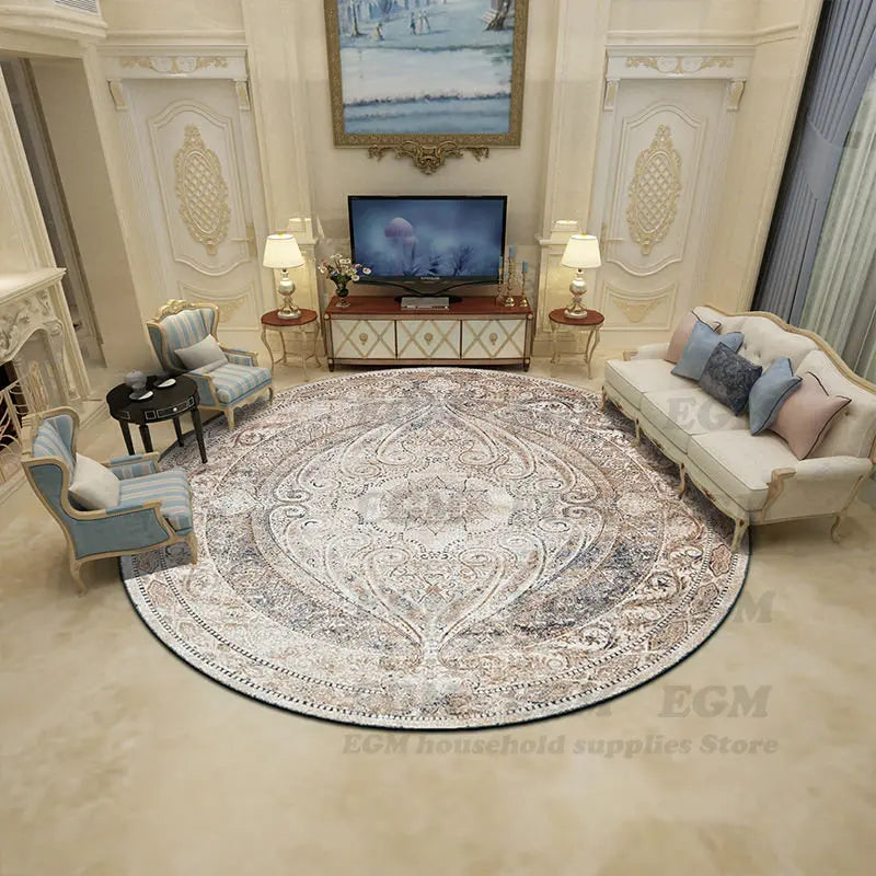 Large round Persian-style rug in a neutral color scheme in an elegant living room