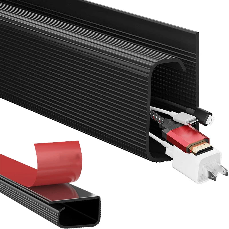 Close-up of open end of cable organizer tray with adhesive backing and various cords